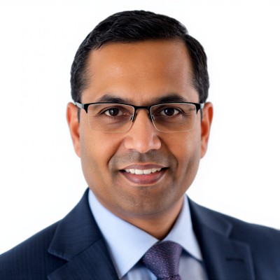 Manoj Panda_Photo Portrait of a man in a suit and glasses at Treasury Career Corner LIVE event.