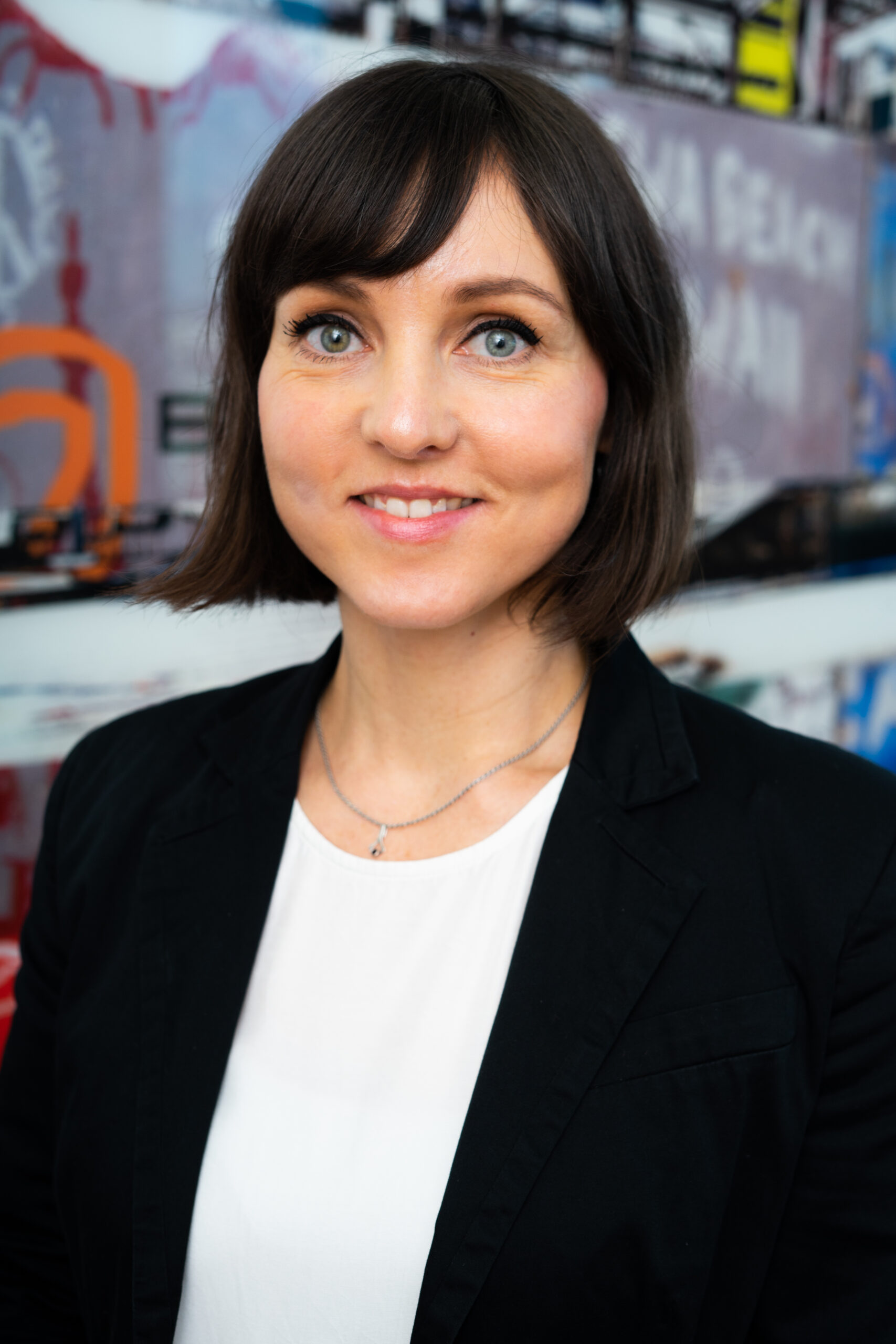 Anika Williams_Photo Woman in black blazer smiling, podcast guest for treasury careers.